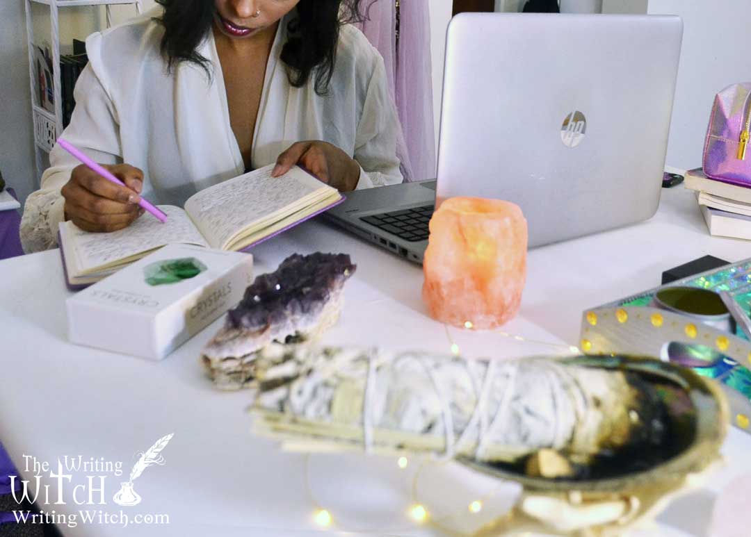 spiritual business desk with sage and crystals