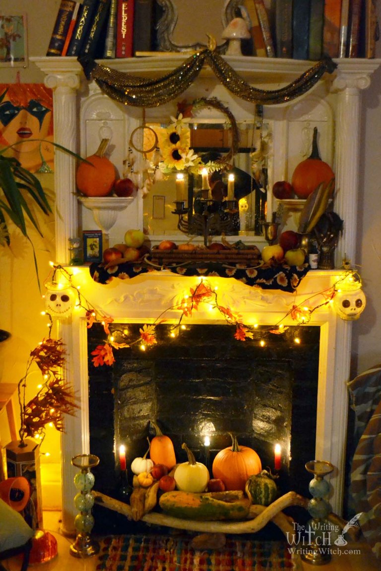 fireplace decorated with pumpkins and candles