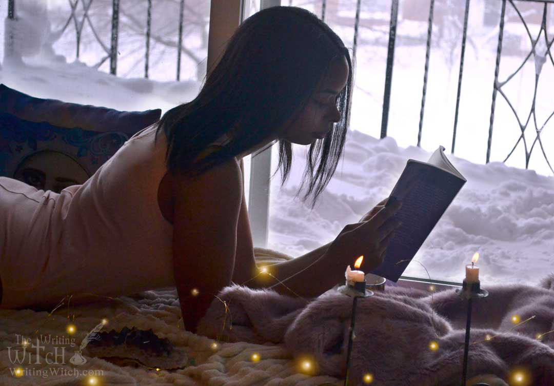 Afura reading in winter near snowy window