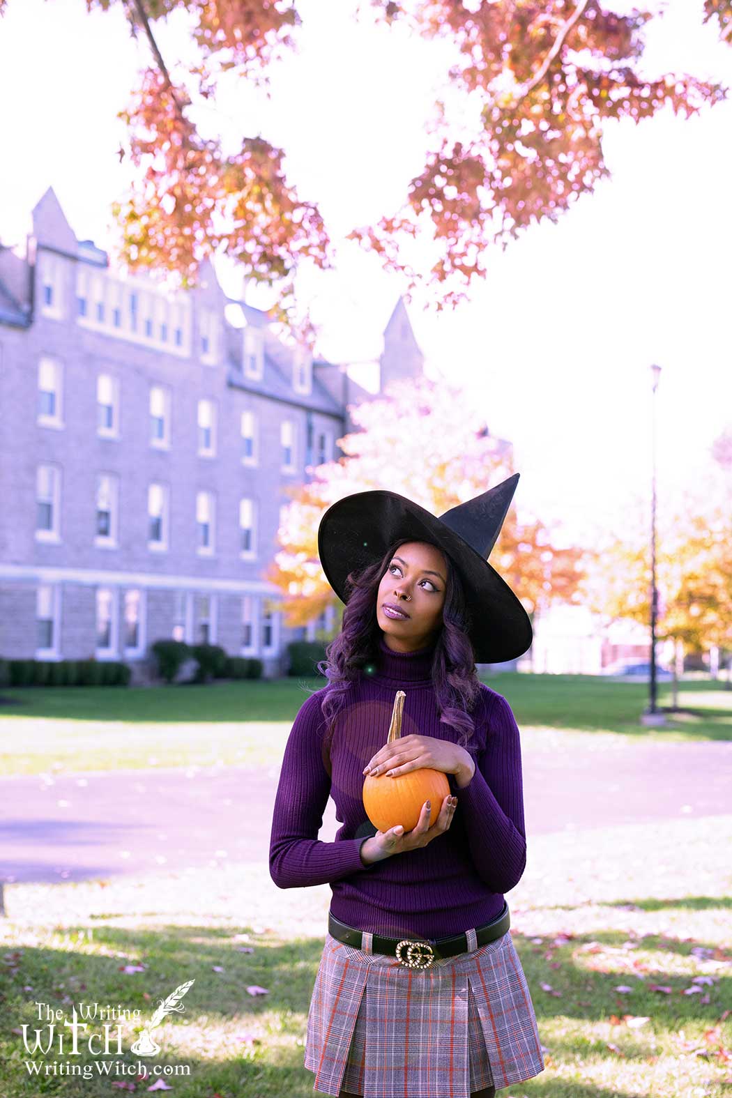 Autumn witch with hat and pumpkin