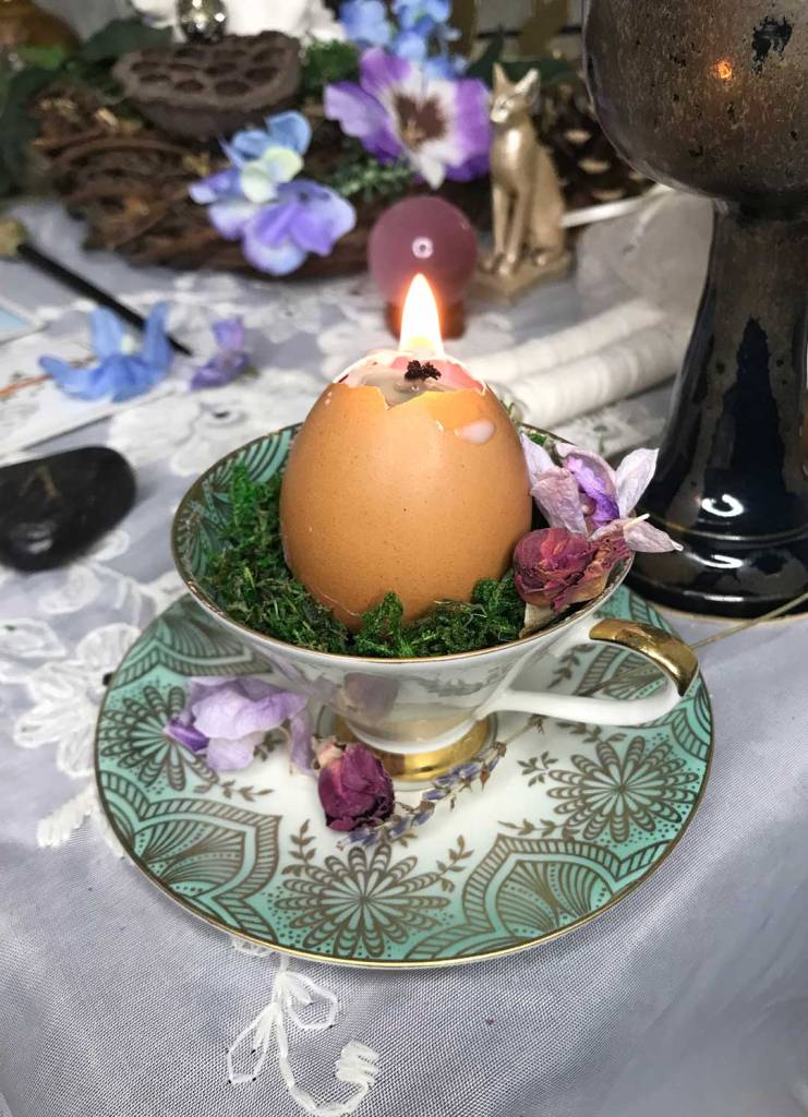 eggshell candle on spring altar
